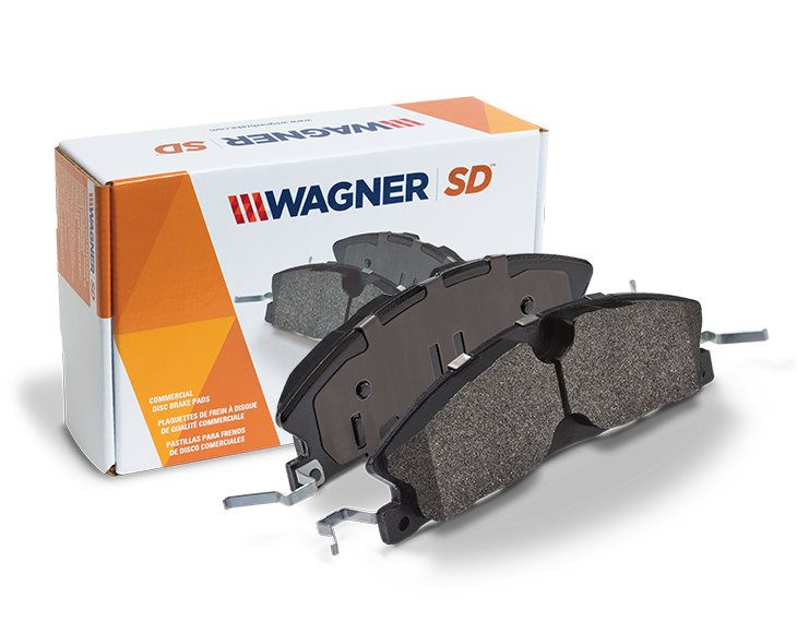 Front view of Wagner SD Brake Pads, along with the packacking for the pads behind